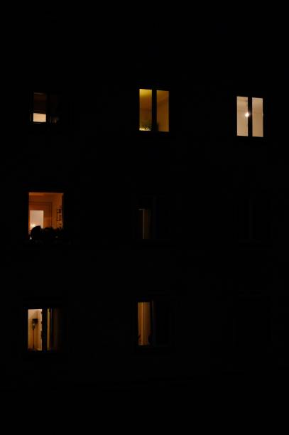 istock Light from Windows of House Building. 1441222812
