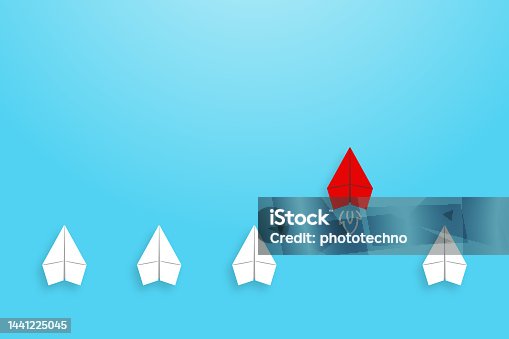 istock Change concepts with red paper airplane leading among white on blue background 1441225045