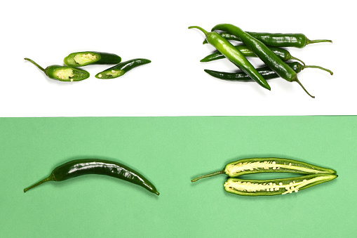 Creative layout made of green chili pepper. High resolution photo. Full depth of field.