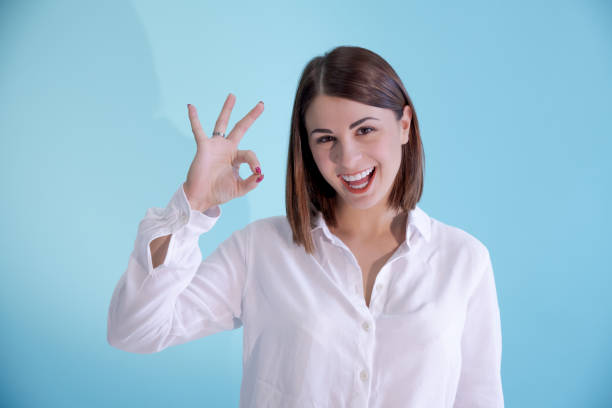 istock Woman shows OK sign 1441228122