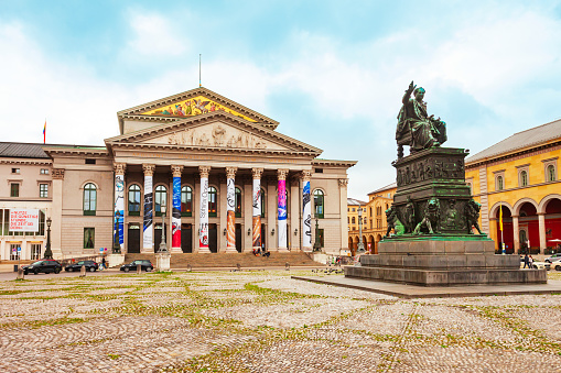Munich, Germany - July 07, 2021: National Theatre or Nationaltheater is a historic opera house, home of the Bavarian State Opera at Max Joseph Platz square in Munich city centre, Germany