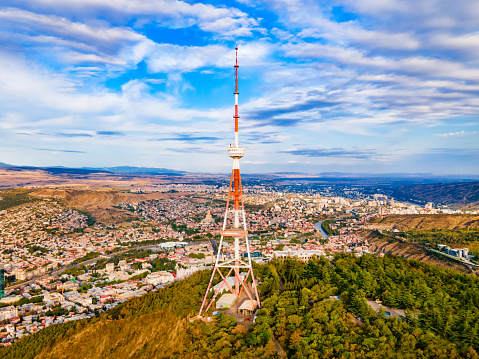 Tbilisi TV Broadcasting Tower aerial panoramic view. Tbilisi is the capital and the largest city of Georgia, lying on the banks of the Kura River.