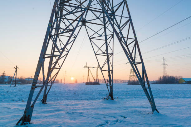 Power line grid in the cold winter morning stock photo