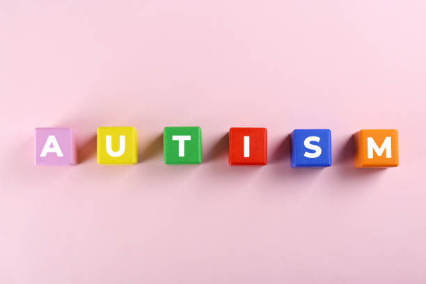 istock Word Autism made with colorful cubes on white background, top view 1441236662