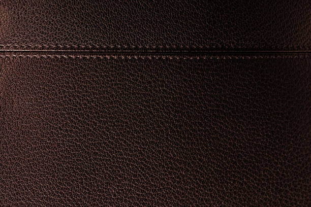 Black leather texture close-up Close-up of a black briefcase (faux leather texture). Space for copy. fake leather stock pictures, royalty-free photos & images