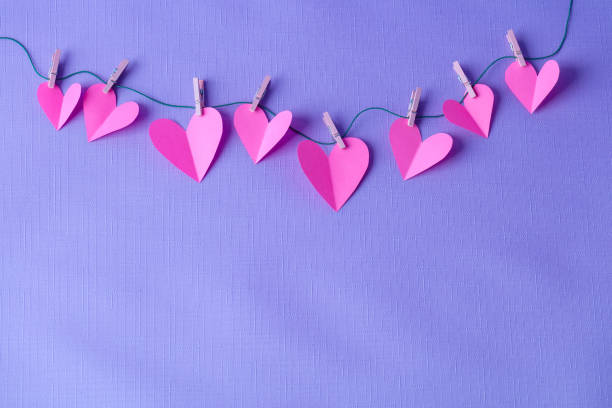 istock Paper hearts hanging on a clothesline with space for copy 1441237320