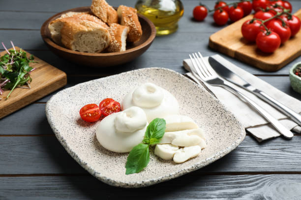istock Delicious burrata cheese served on grey wooden table 1441238932
