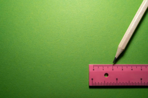 istock Pencil and ruler on a green background with copy space 1441240597
