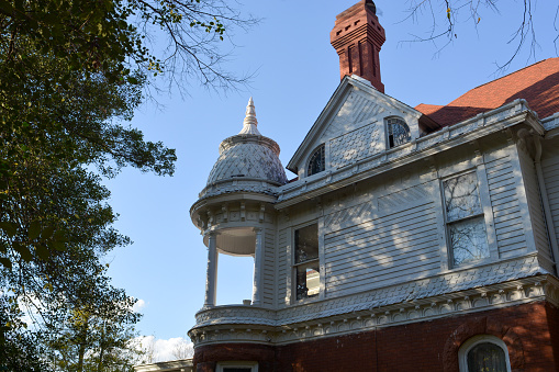 Carthage, MO, 2022: The T. Davey House was designed in the Queen Anne style and features a domed turret, stained-glass windows and chimneys with decorative caps.