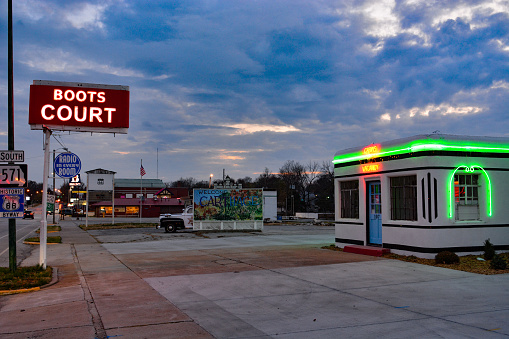 Carthage, MO, 2022:  Neon and a billboard entice motorists to stay at Boots Court on Route 66.