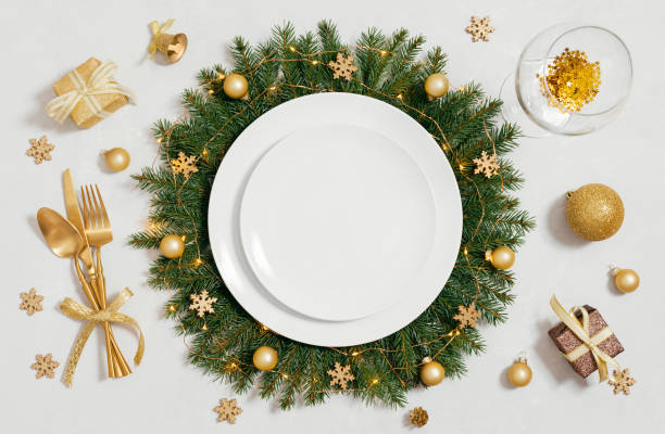 istock Christmas empty table setting with golden accessories on gray background. View from above. Space for text. 1441243617
