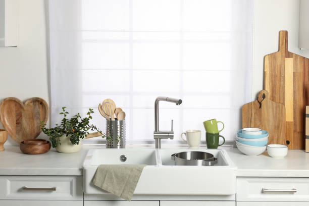 istock Countertop with sink and cooking utensils in kitchen 1441244394