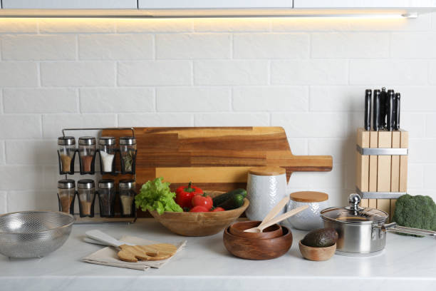 istock Different cooking utensils and fresh vegetables on countertop in kitchen 1441244723