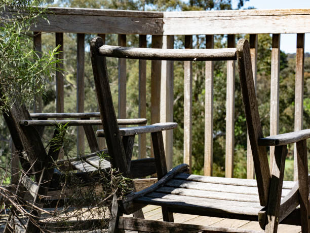 istock Old broken wooden chairs with view 1441246004