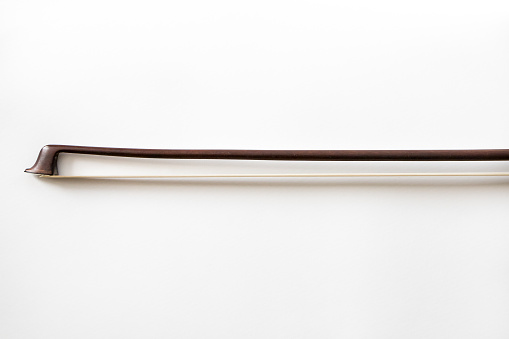 part of the bow for the violin on a white background, musical instrument