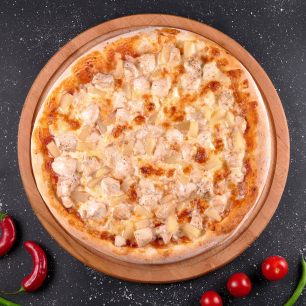 istock photo of pizza on the table 1441246352