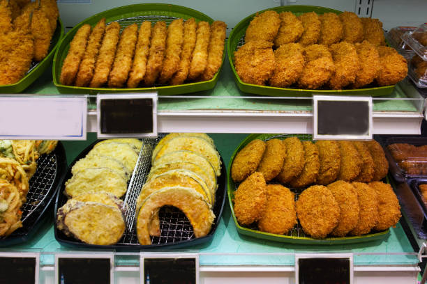 Semi-finished products - fried fish and fried vegetables in a grocery store window