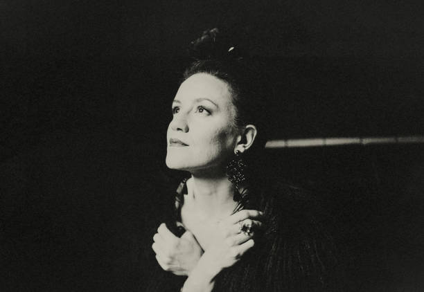 istock The female opera singer accepts her applause on stage. 1441247593