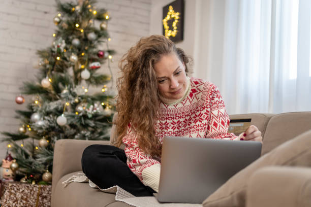 istock Woman making a credit card purchase 1441248509