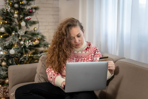 istock Woman making a credit card purchase 1441248721