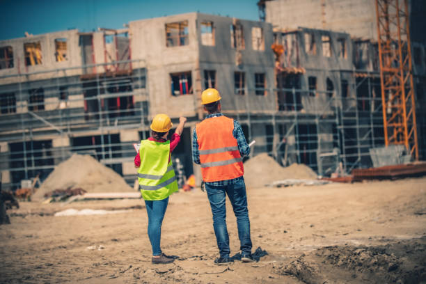 istock Site manager and supervisor on construction site tour. 1441250589