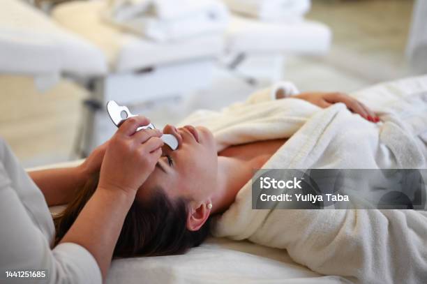 Woman Having An Gua Sha Facial Massage Stock Photo - Download Image Now - Gua Sha, Facial Mask - Beauty Product, The Human Body
