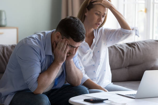 istock Spouses manage finances, analyze expenses, check budget looks disappointed 1441252991