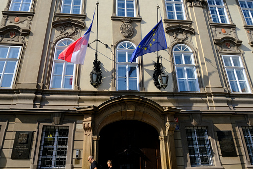 Flags of the Czech Republic and European Union fluttering on an old building in the center of Prague.