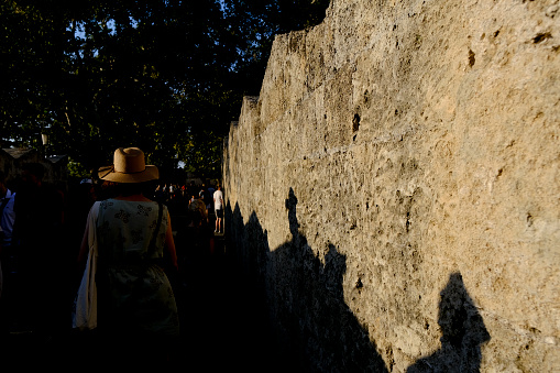 People walk in historic center of Rhodes island in Greece on July 28, 2022.