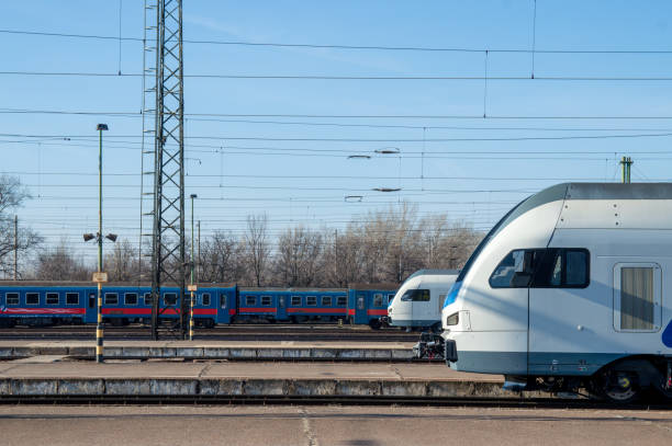 istock Two modern trains wait in the railway station 1441256476