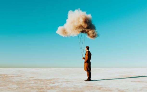 istock Concept image of man holding on to a cloud outside 1441257682