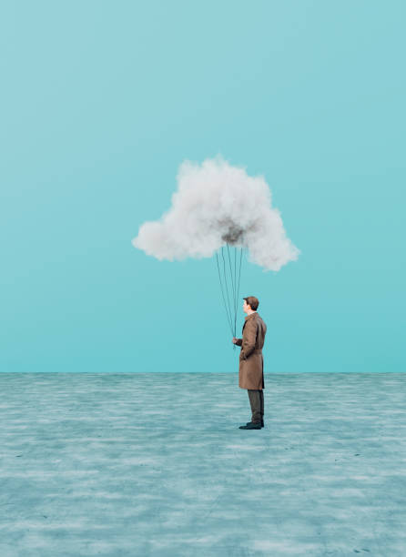 istock Smal cloud connected to man on the ground with strings 1441257694