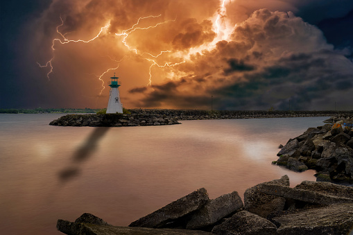 The lighthouse in the small Ontario town of Prescott is seen during a colourful lightning storm over Lake Ontario.