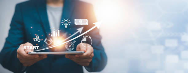 istock 2022 and Startup concept with icon business and network connection on modern virtual interface from digital tablet.Businessman Touching tablet and graph Screen Icon of media screen, Technology Process 1441262478