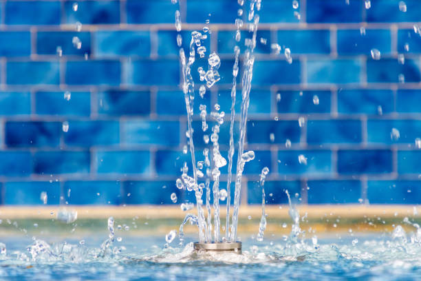istock Small fountain with blue tile background 1441265783