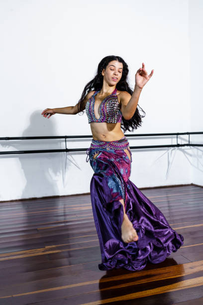 istock Young woman performing belly dance at dance school 1441266310