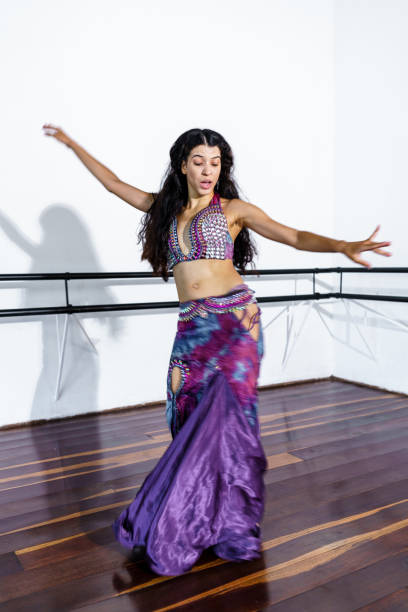 istock Young woman performing belly dance at dance school 1441266569