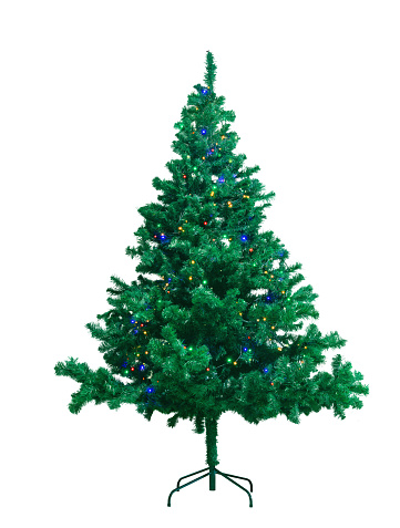 green artificial Christmas tree on a stand, isolated on a white background