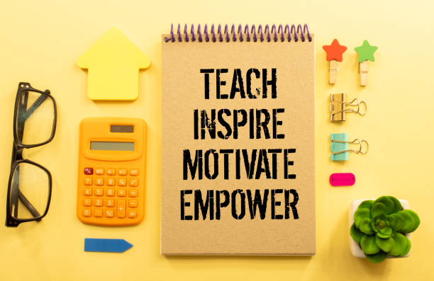 istock Open notebook with text Teach inspire motivate empower on wooden background 1441269747