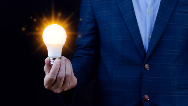 istock Bright idea in hand Business man,Hands holding light bulb for concept new idea concept with innovation and inspiration,technology in science and communication concept 1441273273
