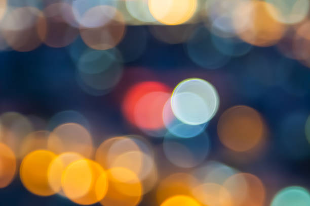 istock Abstract city lights blur blinking background. Soft focus horizontal long banner. Bokeh sparkles colorful defocused on dark texture for night party city. Abstract blurred pattern template. 1441275762