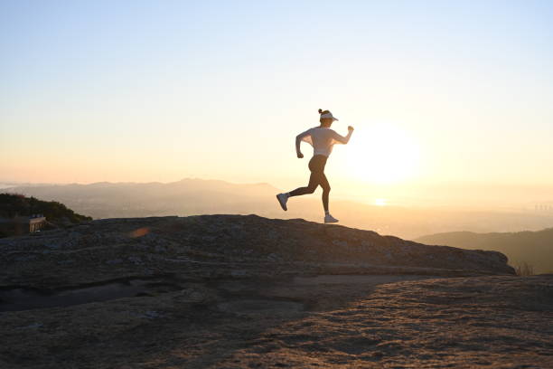 istock woman running on ridge 1441275796