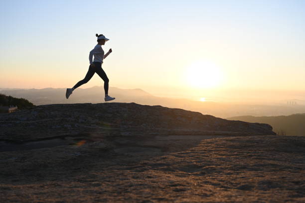 istock woman running on ridge 1441275815