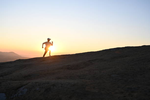 istock woman running on ridge 1441275853