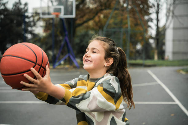 istock Little girl is playing outside 1441278856