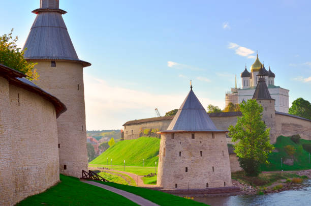 The Old Russian Pskov Kremlin The Old Russian Pskov Kremlin. Fortress walls with old towers of the 14th-16th centuries at the mouth of the river. Pskov, Russia, 2022 pskov russia stock pictures, royalty-free photos & images