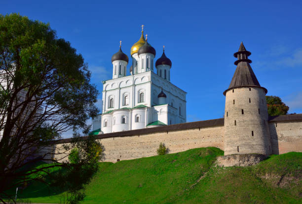 The Old Russian Pskov Kremlin. Trinity Cathedral of the 17th century behind the fortress wall at the Middle Tower. Pskov, Russia, 2022