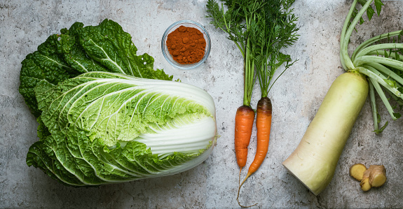 Kimchi ingredients: napa cabbage, daikon radish, ginger, carrots and hot pepper.