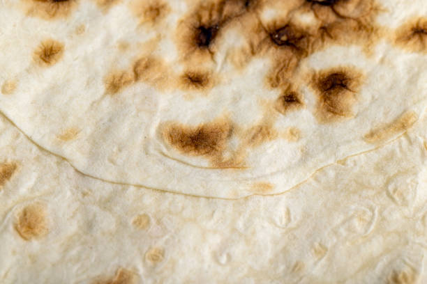 istock Wheat pita bread with dark spots 1441286324