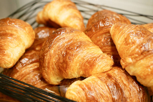 istock many fresh baked croissants in a box 1441289531